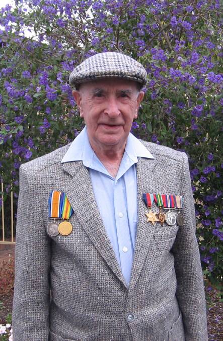 The late Norman Gow wears the missing medals of his father on his right-hand side.