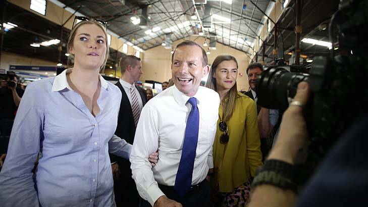Tony Abbott and his daughters, Bridget and Frances, in Brisbane on the campaign trail last year. Photo: Alex Ellinghausen 