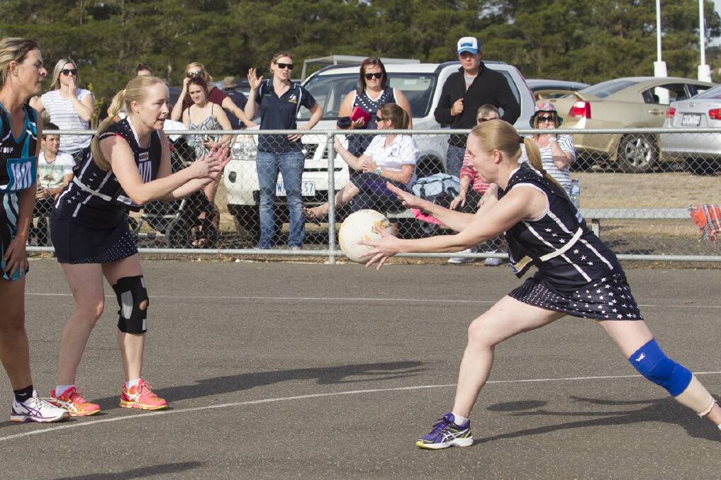 DOUBLE TROUBLE: Olivia West passes into twin sister Sarah during the Ararat Eagles clash with Moyston/Willaura. Olivia, Ararat Rats joint-coach, played on permit with the Eagles to get some match fitness ahead of the Wimmera Netball Association season. Picture: PETER PICKERING