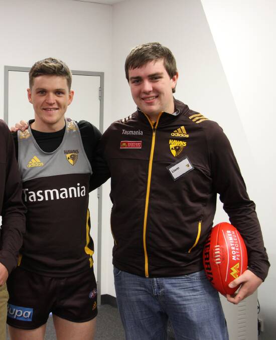 SM&W Rovers footballer Liam Baker with Hawthorn player Taylor Duryea during the Mortimer Petroleum Performance Program.