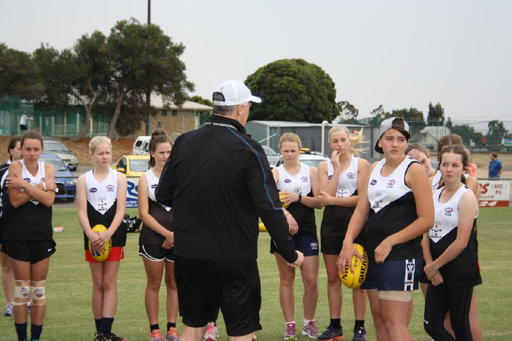 Head coach of the Youth Girls Academy Jeff Whittaker conducts the training session at Alexandra Oval.