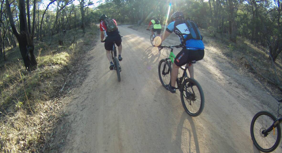 Members of the Ararat Dirt Riders Club pedal along a track through the Ararat Hills on one of their monthly group rides.