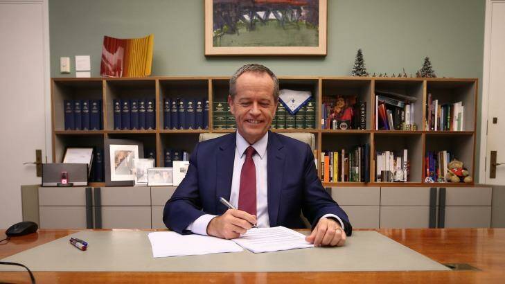 Opposition Leader Bill Shorten poses for photos in his office ahead of delivering his budget reply speech. Photo: Alex Ellinghausen