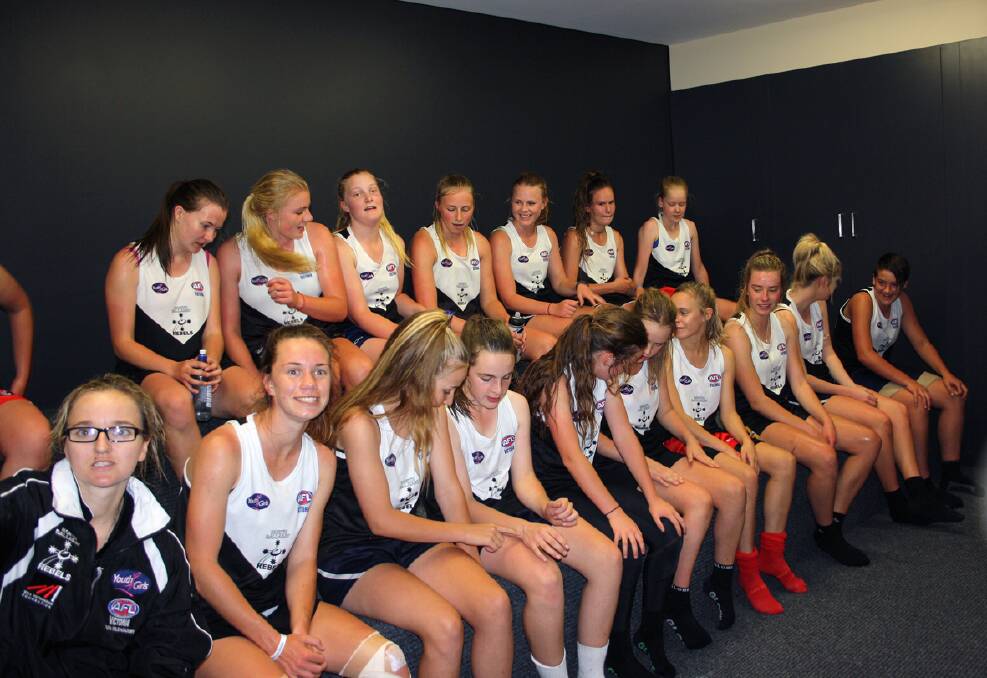 The North Ballarat footballers gather in the Alexandra Oval's new coach's room facility.