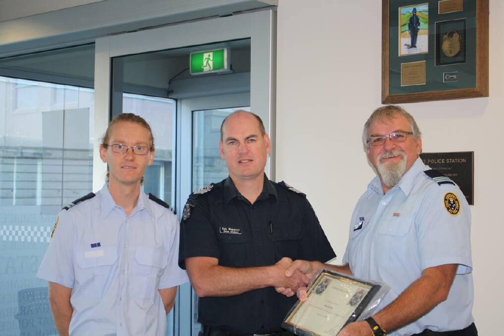 James Treloar (left) and Alan Blight from the Stawell SES Unit received a certificate of appreciation from Stawell Senior Sergeant Rob Weppner.