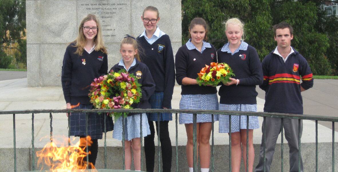 Lauren Bowles from Ararat College, Abby Tiley from Beaufort Secondary College, Peta Chaplin from Marian College, Jasmine Clark and Amy McIntyre from Lake Bolac College and Bob McKenzie from Stawell Secondary College at the Shrine of Remembrance.