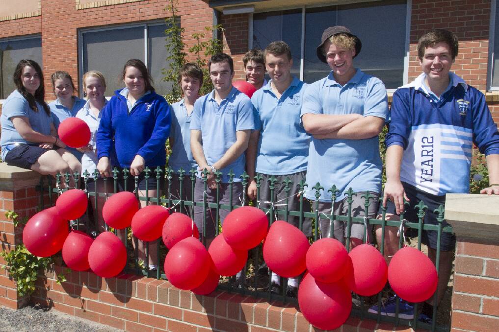 Marian College students Mahnee, Shelby, Tash, Cahlie, Jack, Josh, Nathan, Jarrod, Thomas and Reece with the red balloon theme