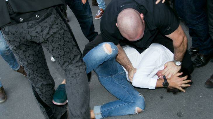 Kardashian West's bodyguard Pascal Duvier tackles Sediuk to the ground. Photo: Marc Piasecki