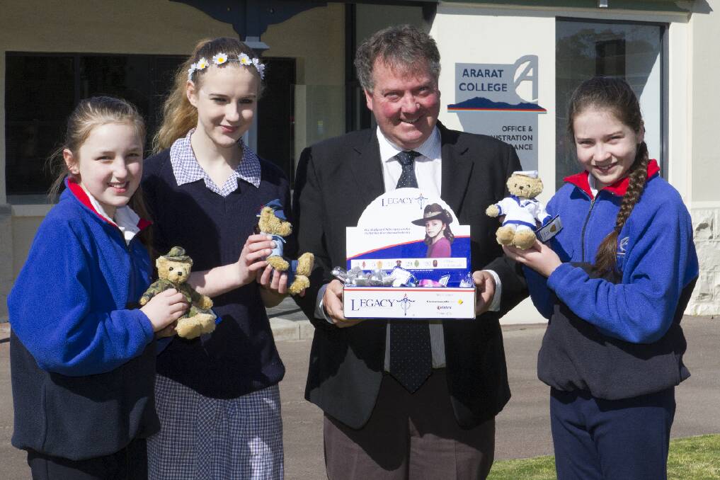 Annalise, Lauren and Toneya and Ararat College principal Geoff Sawyer with the Legacy products which will be sold by the students today. Picture: PETER PICKERING