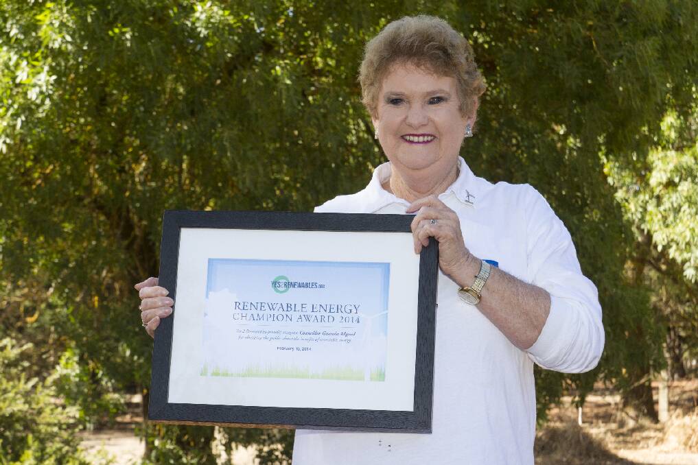 Gwenda Allgood with the Renewable Energy Champion Award she was presented with.