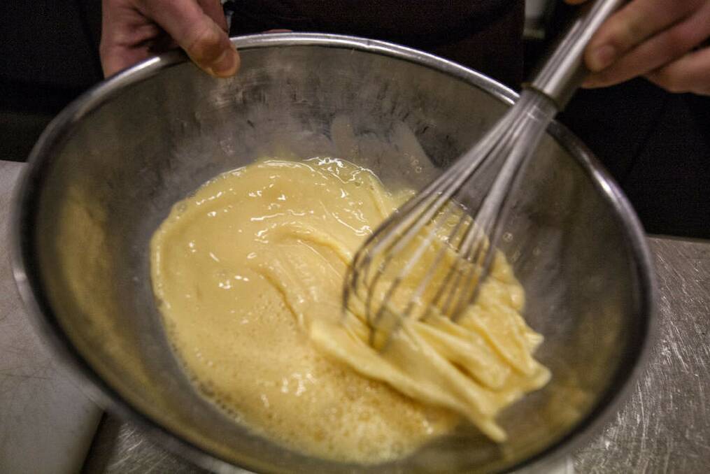 Pour the eggs and milk into a large mixing bowl and add the pinch of salt. Whisk thoroughly with an electric hand beater or hand whisk. Leave to stand for 10 minutes. Photo: Luis Ascui