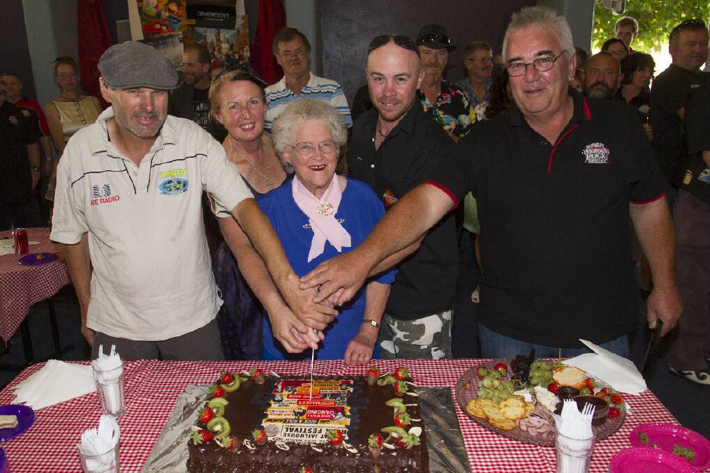 The Ararat Jailhouse Rock Festival committee awarded four life memberships at the launch of the 20th festival. Pictured is original life member Mabel Gibson, centre, with the four newest life members, Michael Streeter, Janice Wilson, Brad Connarty and Ian Preston, cutting the cake. Picture: PETER PICKERING