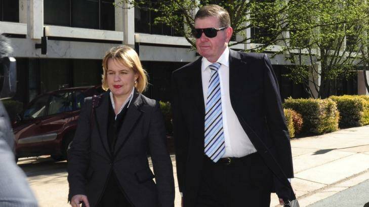 Peter Slipper arrives at the Magistrates Court with his lawyer, Kylie Weston-Scheuber. Photo: Melissa Adams
