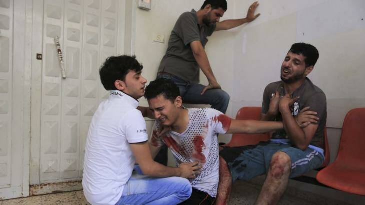 Relatives of a man reportedly killed by an Israeli air strike grieve at Gaza's Shifa Hospital. Photo: New York Times