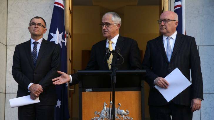 Prime Minister Malcolm Turnbull and Attorney-General George Brandis announced Brian Ross Martin as Royal Commissioner of the Royal Commission into juvenile detention in the Northern Territory on Thursday. Photo: Andrew Meares