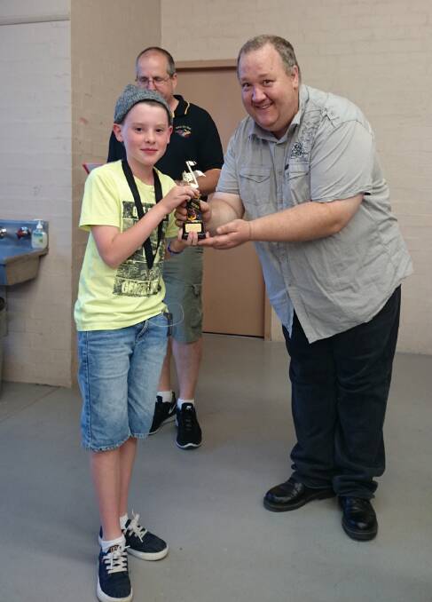Most improved learner Jacob Pearce receives his award from Ararat City Band president Scott Barrie.