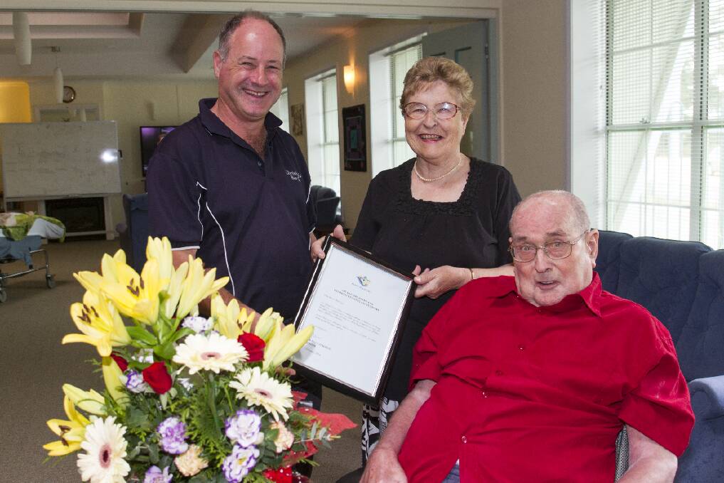 Ararat Rural City Mayor Cr Paul Hooper presented Joy and Geoff Cox with a certificate and flowers celebrating their 50 years of marriage. Picture: PETER PICKERING