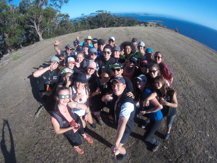 SELFIE TIME: Ararat and Wonthaggi students stop to take a snap at the top of a mountain peak during their four-day camp in Tasmania.