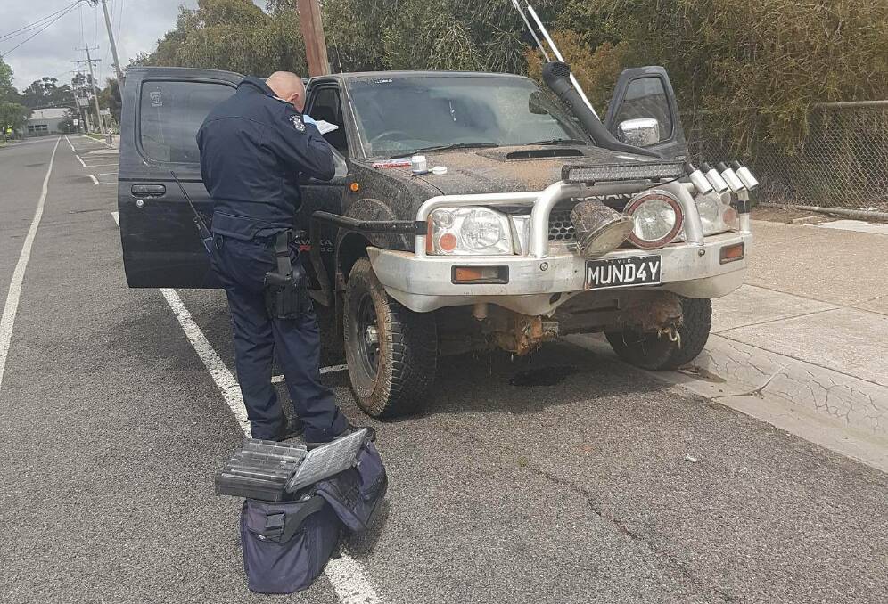 DISAPPOINTED: Police investigating Marc Mundy's abandoned vehicle. 