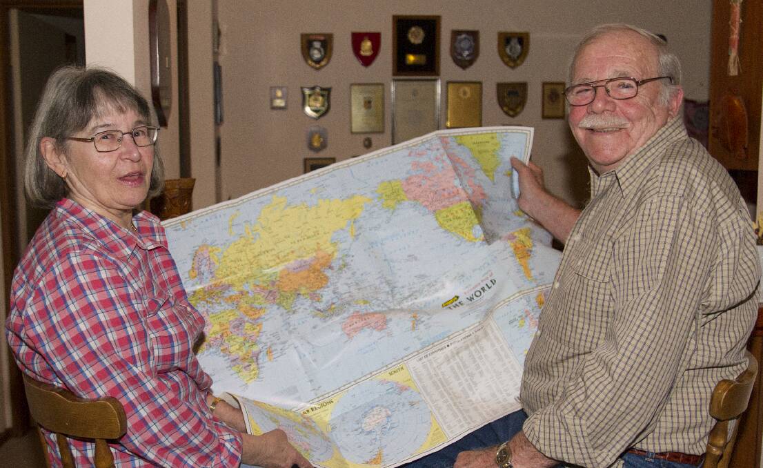 Maija and Kerry Hill with a map including his old Federal police region. Picture: PETER PICKERING. 