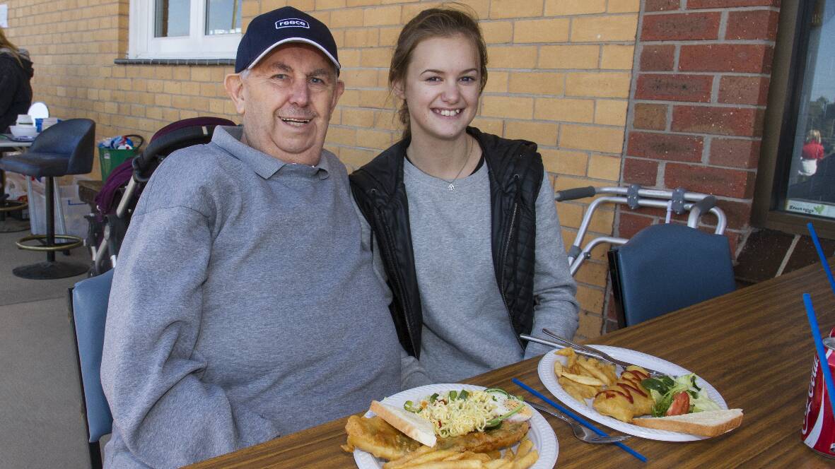 John Nuske sat down to enjoy his fi sh and chip lunch with granddaughter Dana. Picture: PETER PICKERING. 