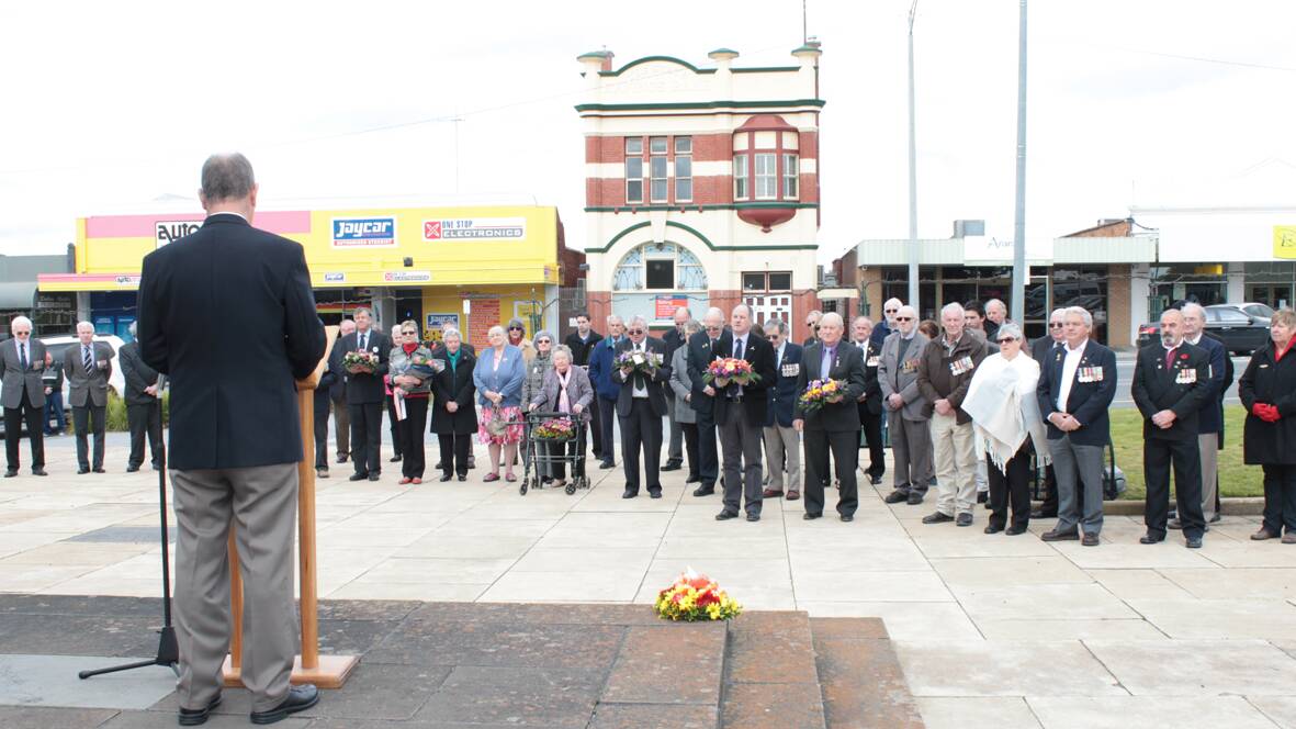 Guest speaker at the Vietnam Veterans' Remembrance Day, Stand Whitford addresses the large gathering at the Ararat War Memorial on Monday. 