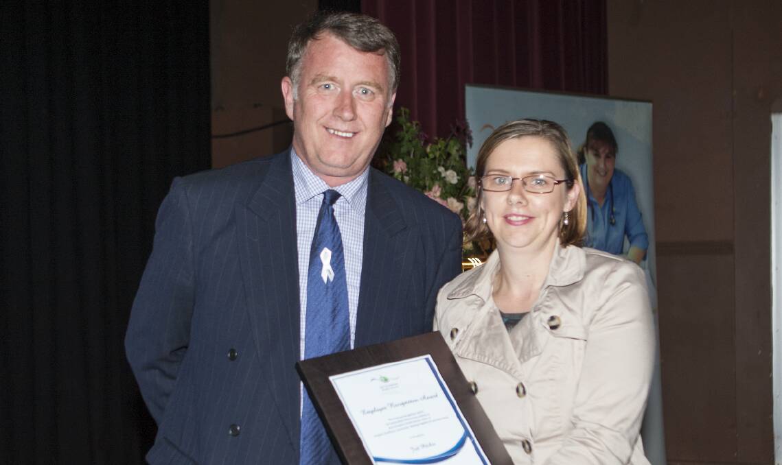Don Cole (left) presents the Employee Recognition award to Jodi Pitcher. Picture: PETER PICKERING