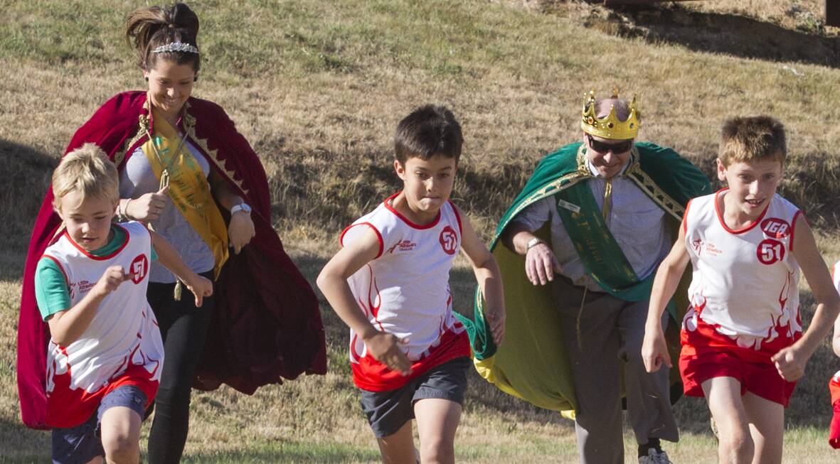 Golden Gateway Festival Queen Meg White and King Derek Pope give little athletes (L-R) Cooper, Jack and Jackson a run for their money in week three of Ararat Little Athletics. Picture: PETER PICKERING
