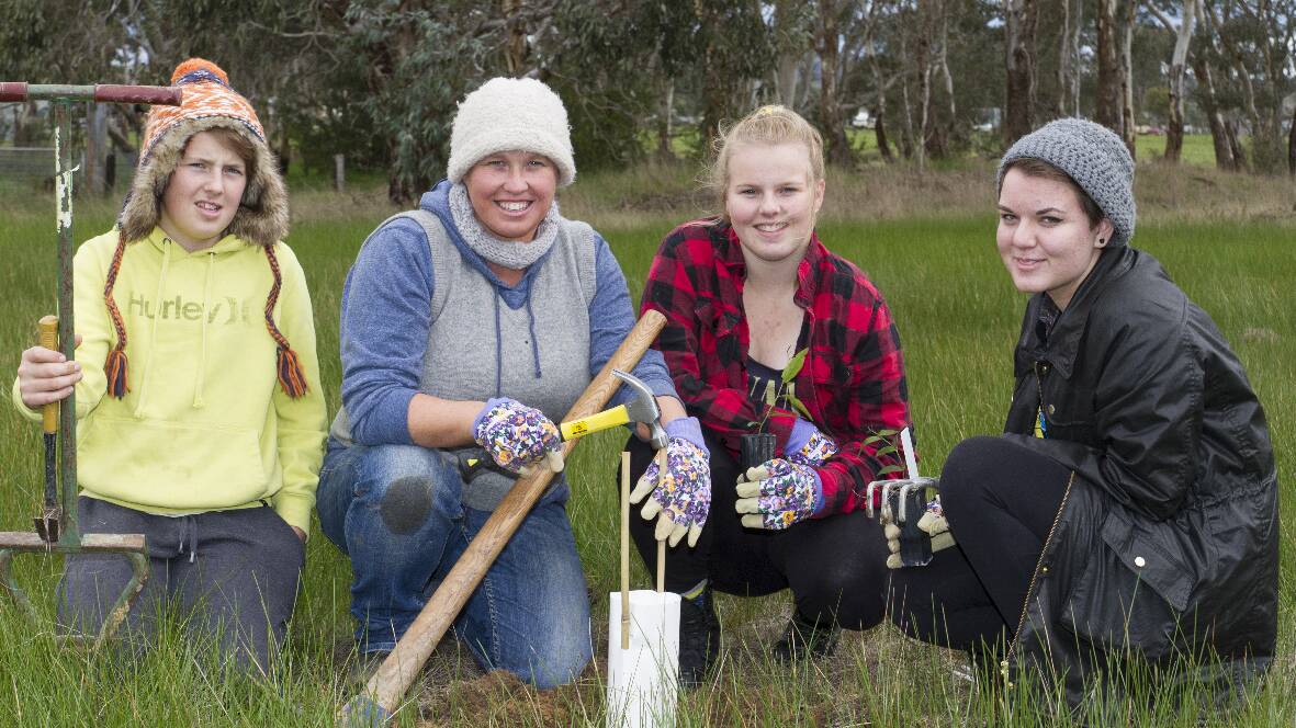 Tree planters on the job at Cemetery Creek (L-R) Brenton, Terry Anne Lewis, Allison and Amber. Picture: PETER PICKERING.