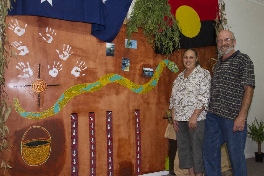 Sue and Peter Horvath admire a giant mural on show at the exhibition. Picture: PETER PICKERING.