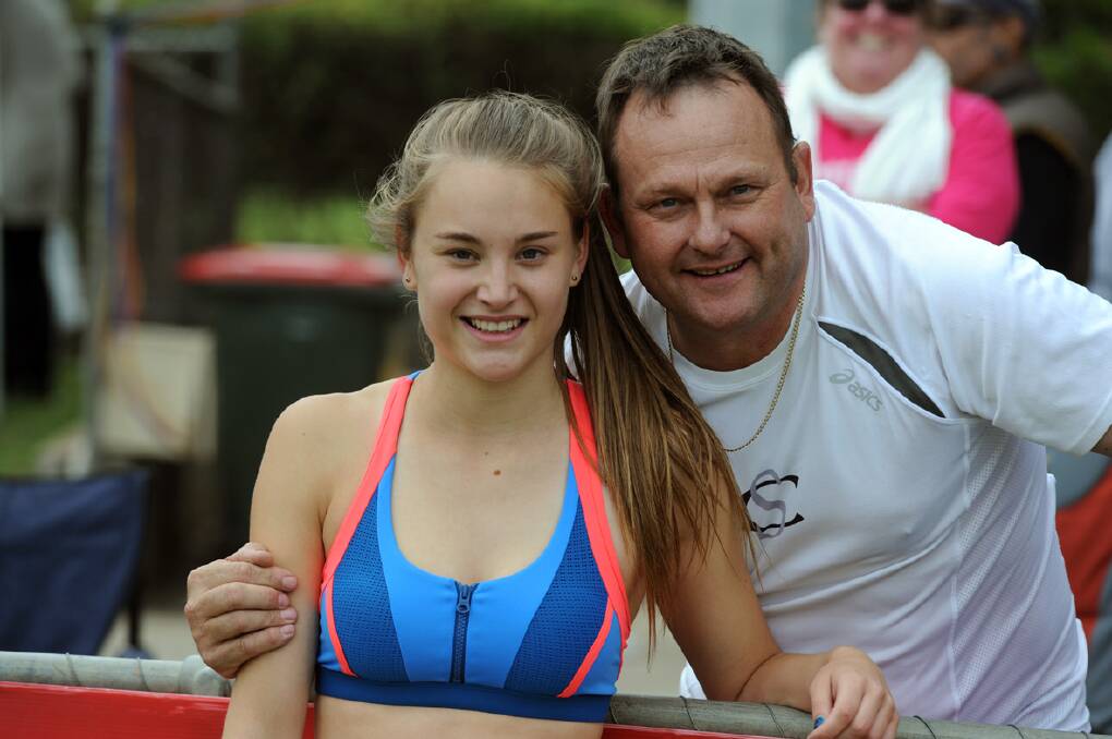 Sarah Blizzard with her dad Neil, after winning her heat ahead of the Strickland Family Women's 120 metre Gift at Stawell.