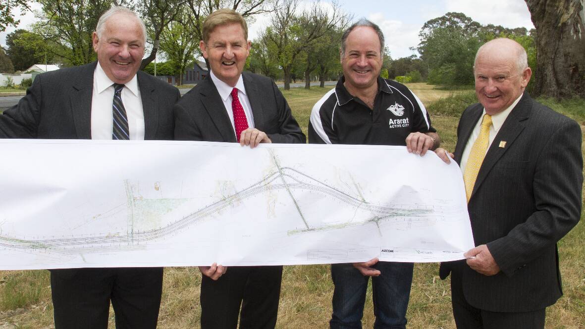 Northern Grampians Shire Mayor Cr Kevin Erwin, Deputy Premier Peter Ryan, Ararat Rural City Mayor Cr Paul Hooper and Pyrenees Shire Mayor Cr Robert Vance with a plan of the Buangor bypass. Pictures: PETER PICKERING