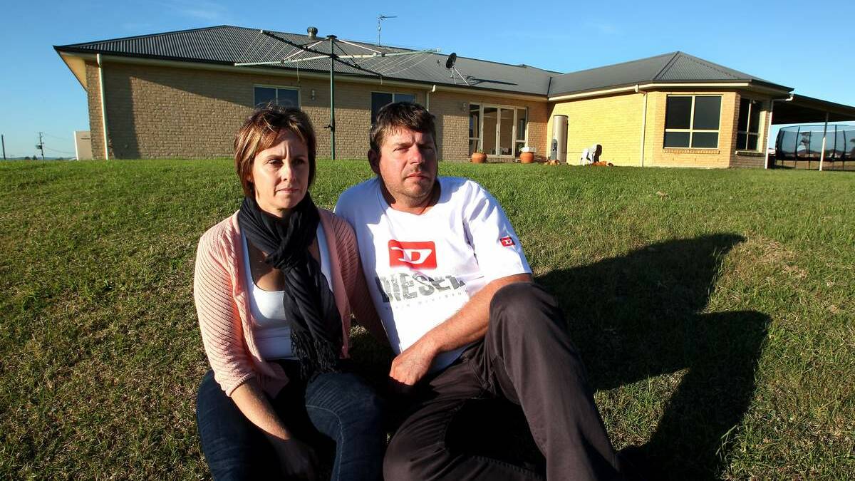 Kylie and Andrew Neale on their property which is affected by mine subsidence.  Picture: Phil Hearne