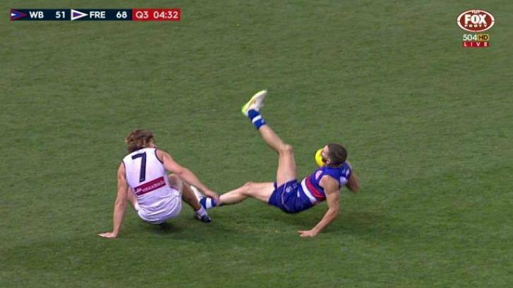 The incident: Nat Fyfe was reported for tripping Koby Stevens. Photo: Fox Footy.