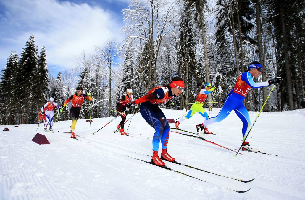 Anastasia Dotsenko (C) of Russia and Aino-Kaisa Saarinen of Finland lead a group during the Women's Team Sprint Classic Semifinals during day 12 of the 2014 Sochi Winter Olympics at Laura Cross-country Ski & Biathlon Center on February 19, 2014 in Sochi, Russia. Photo: GETTY IMAGES
