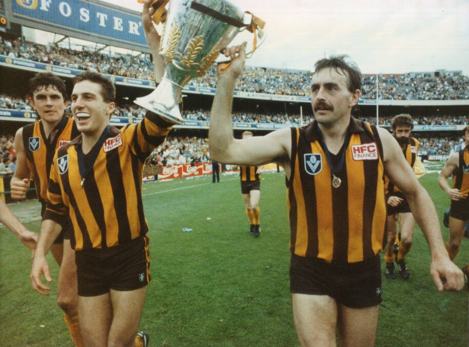 Hawthorn Scott Maginnes and John Kennedy with the 1989 Premiership cup after winning the 1989 grand final. Fairfax photos.