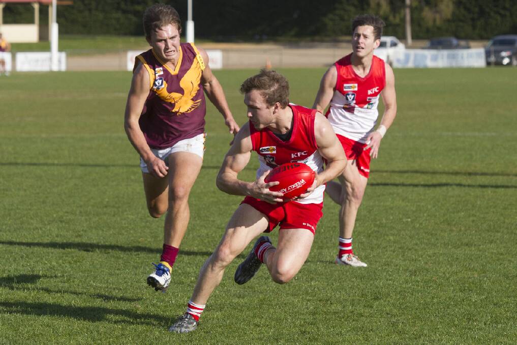 CATCH ME IF YOU CAN: Jake Robinson evades his Warrack Eagles’ opponent during the 61-point victory at Alexandra Oval. Picture: PETER PICKERING