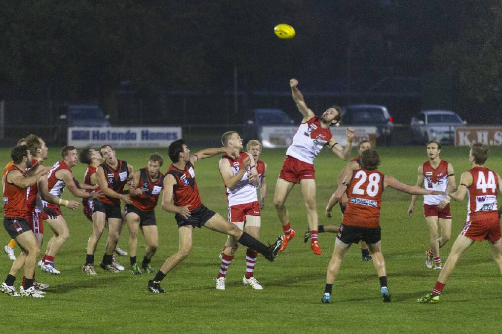 Beau Cosson looks to punch the ball forward during round two's encounter with Stawell. Pictures: PETER PICKERING