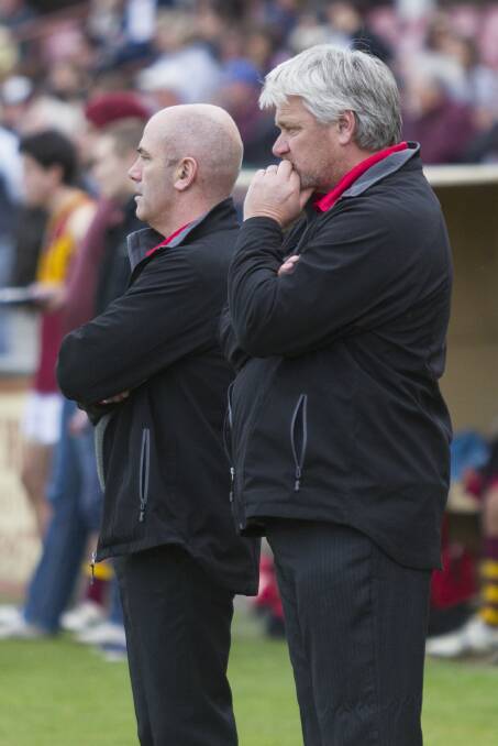 Ararat coaches David Hosking and Andrew Louder watch their team compete against the Warrack Eagles during the home and away season. The Rats will battle the Eagles again tomorrow in the first semi final.