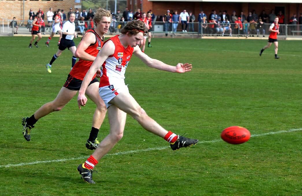 Ararat midfielder Harry Ganley sends the ball forward during the Rats’ hard fought 10-point victory over Wimmera rivals Stawell at Central Park on Saturday. The win propelled Ararat into the finals for the first time since 2010. Pictures: MARK MCMILLIAN