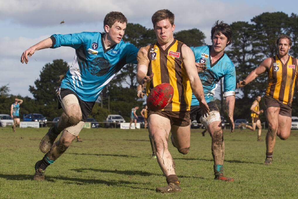 Brothers Ryley Hamilton (left) and Jacob Hamilton apply pressure to Tatyoon midfielder Brodie Mines during Moyston/Willaura’s 20-point win over the Hawks on Saturday. Picture: PETER PICKERING
