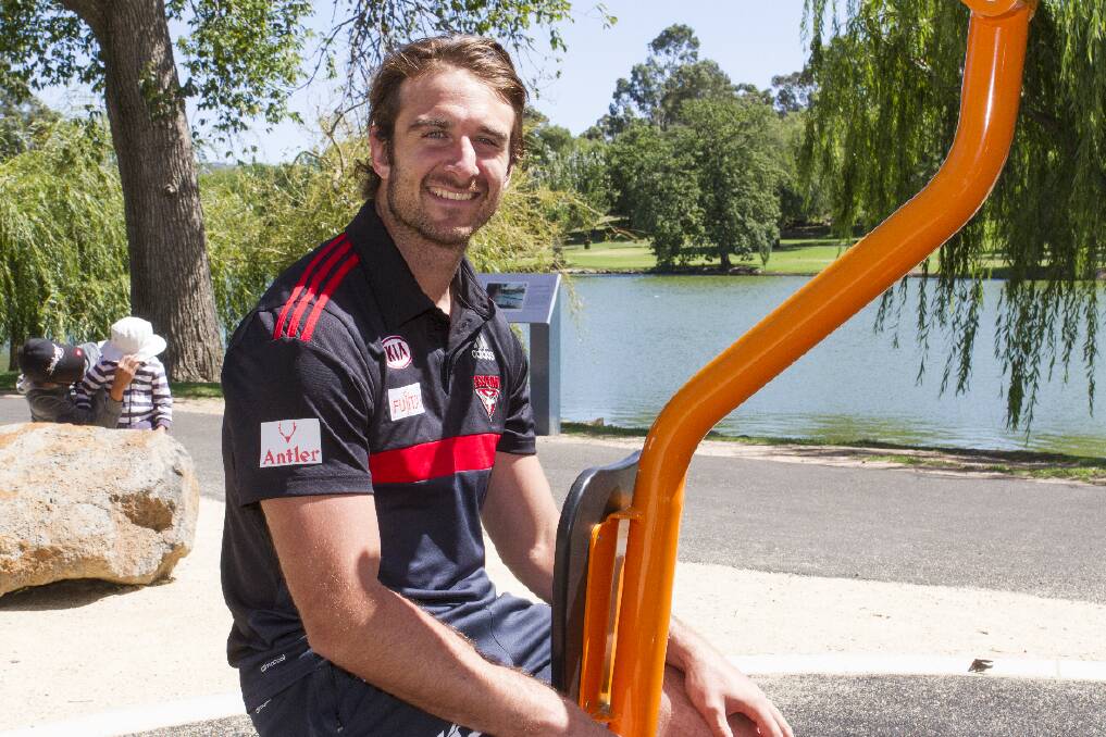 Essendon captain Jobe Watson tested out some of the new exercise equipment at Alexandra Gardens during a trip to Ararat on Tuesday. Hundreds of school students got the chance to get up close with the Brownlow medallist and other players from the Bombers during football clinics held throughout the day. Picture: PETER PICKERING