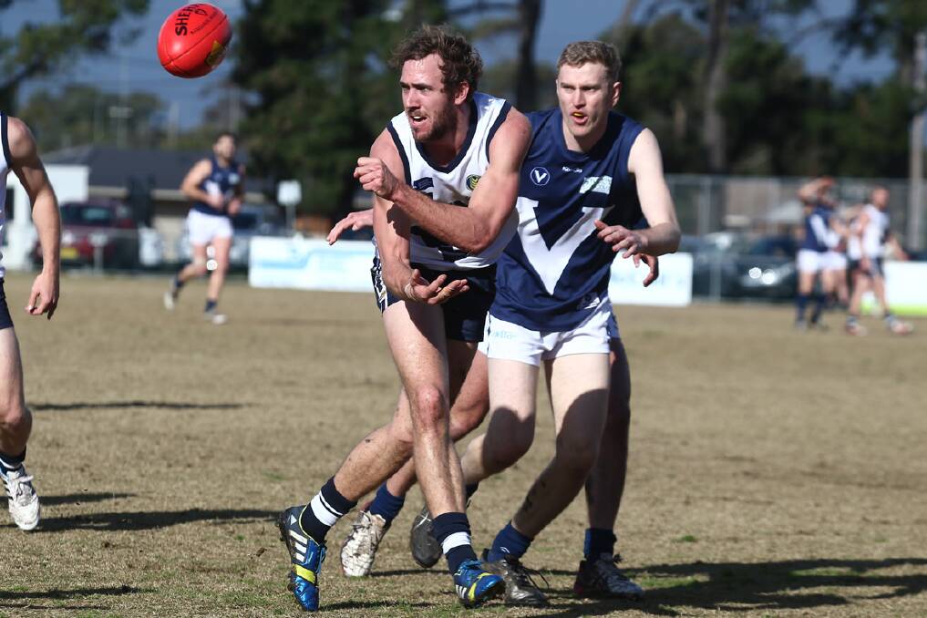 Beau Cosson fires off a handball playing with the VicCountry’s number two side on Saturday. Cosson kicked two goals in the Big V’s win over the Victorian Amateur Football Association. Picture: AFL VICTORIA
