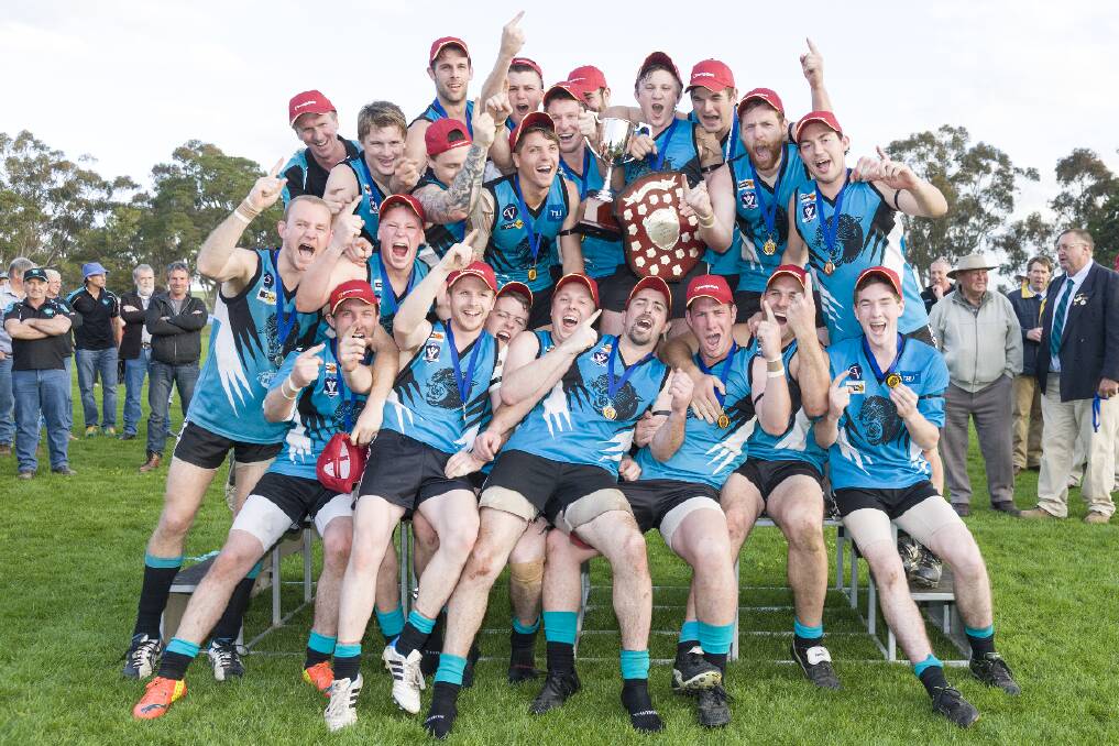 The Moyston/Willaura team celebrates on Saturday after winning its fi rst senior premiership as a united club. The Pumas defeated Tatyoon by 48 points at Glenthompson. Pictures: PETER PICKERING
