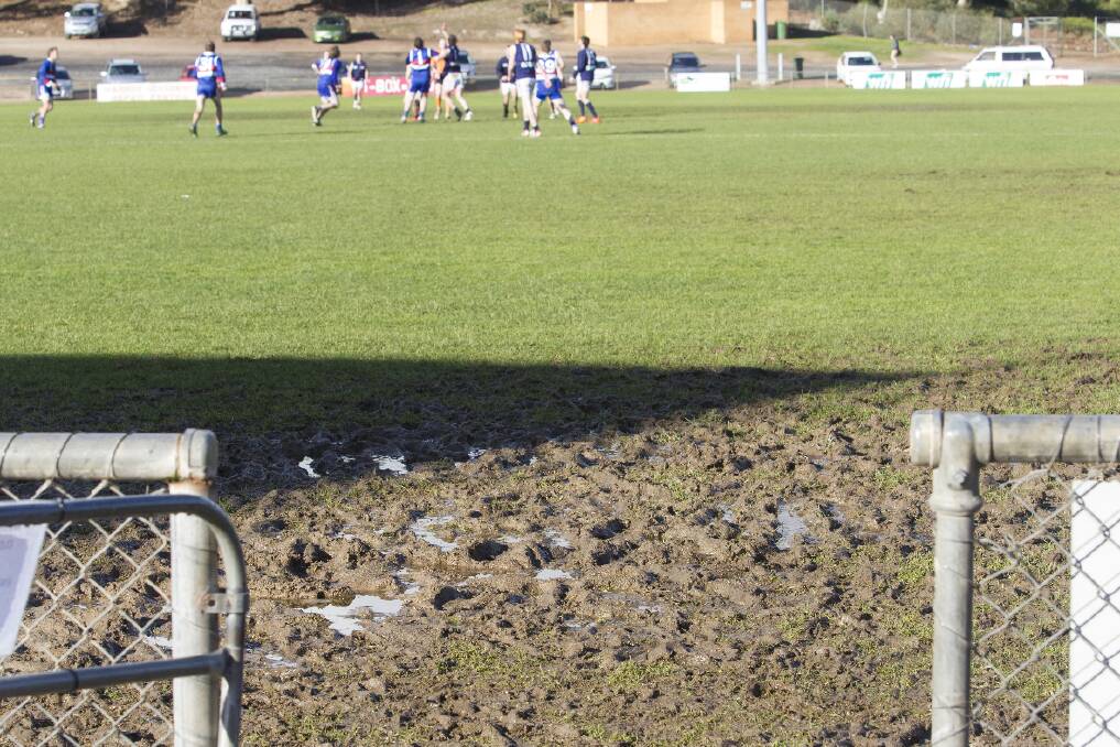 Despite some sunshine on this day of footy at Alexandra Oval, the surface is 
failing to dry out, with large patches of mud evident.