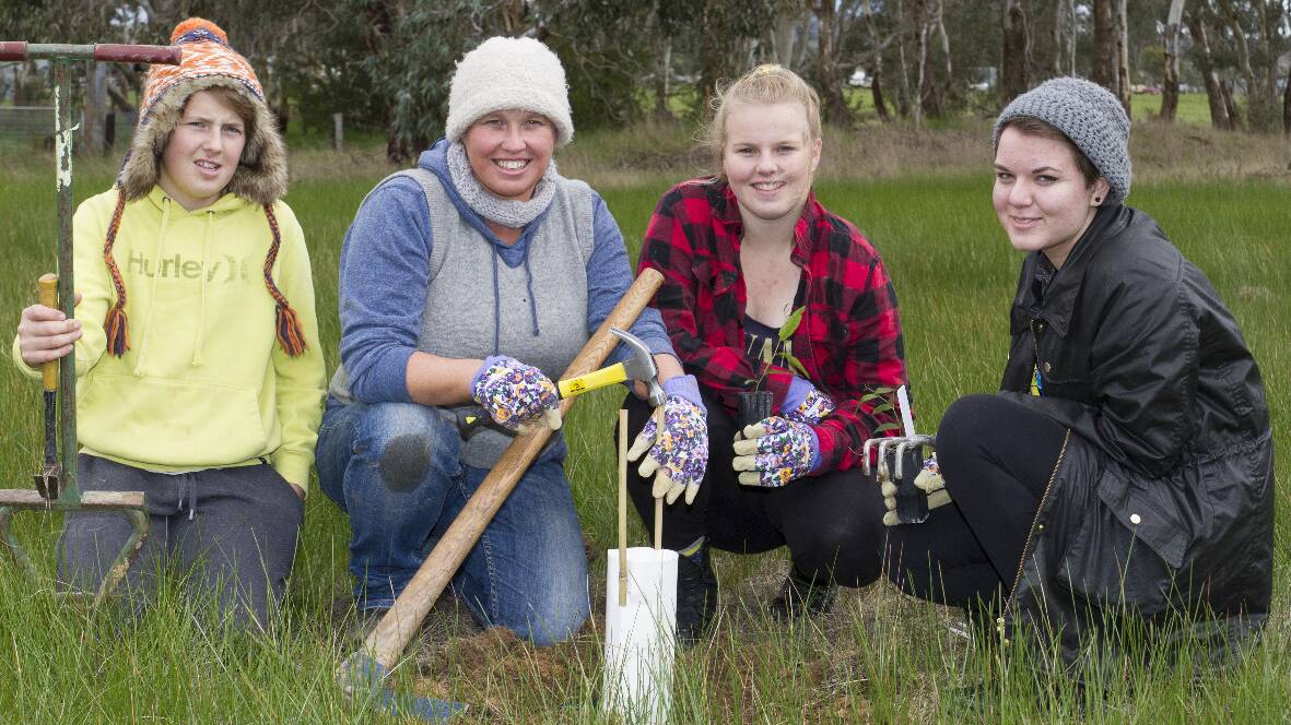 Brenton, Terry Anne Lewis, Allison and Amber plant trees at Cemetery Creek to celebrate National Tree Day. Full story in tomorrow's Ararat Advertiser.