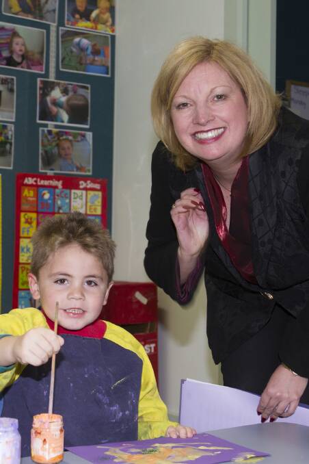 Minister for Children and Early Childhood Development Wendy Lovell officially opened the redevelopment of the Ararat North KinderCare facilities last Thursday and is pictured enjoying some play time with young Caleb. Full story - See Friday s Ararat Advertiser. Picture: PETER PICKERING