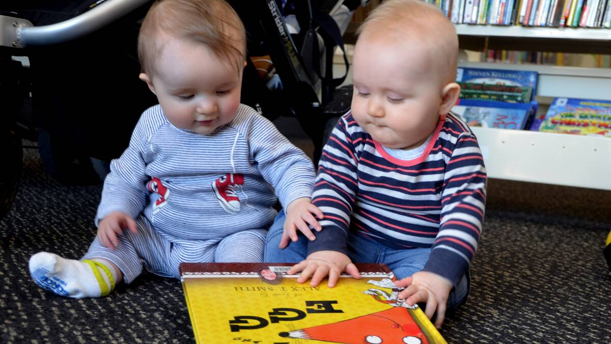 Storytime at the Ararat Regional Library is always fun, with parents and children of all ages attending each Thursday. Archie and Oscar prove that it’s never too early to begin a love of books. Picture: MARK MCMILLAN
