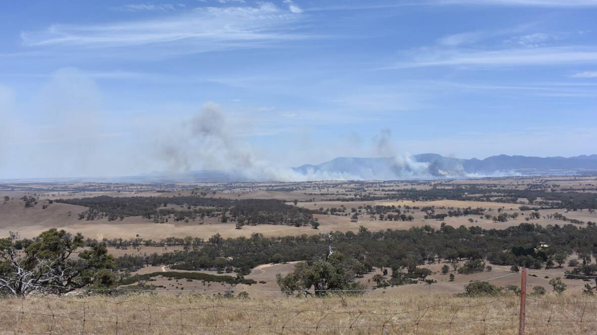 Smoke from the fast moving grass fire is visible from the top of One Tree Hill in Ararat. Pictures: JODIE HOLWELL