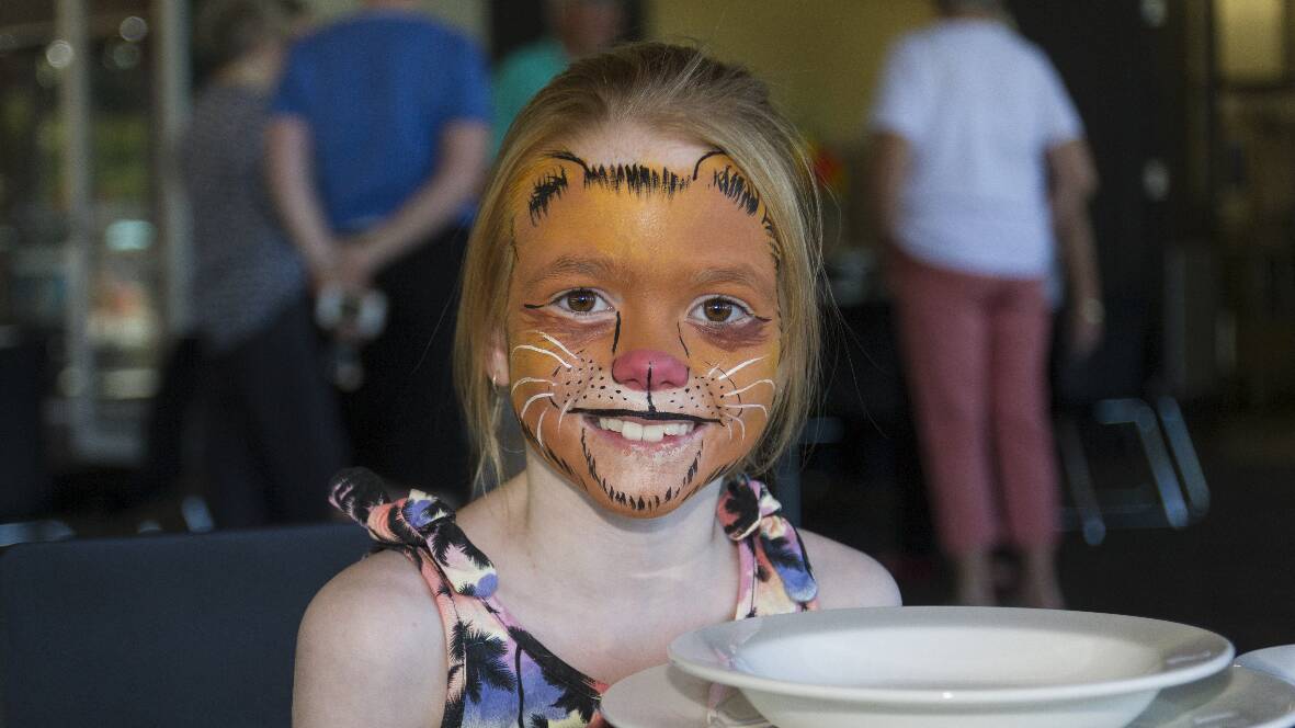 Josie with some wild face paint courtesy of Robyn and Corey Cleggett from Cleggart Facing Painting during last Friday's open day Alexandra Oval. Picture: PETER PICKERING